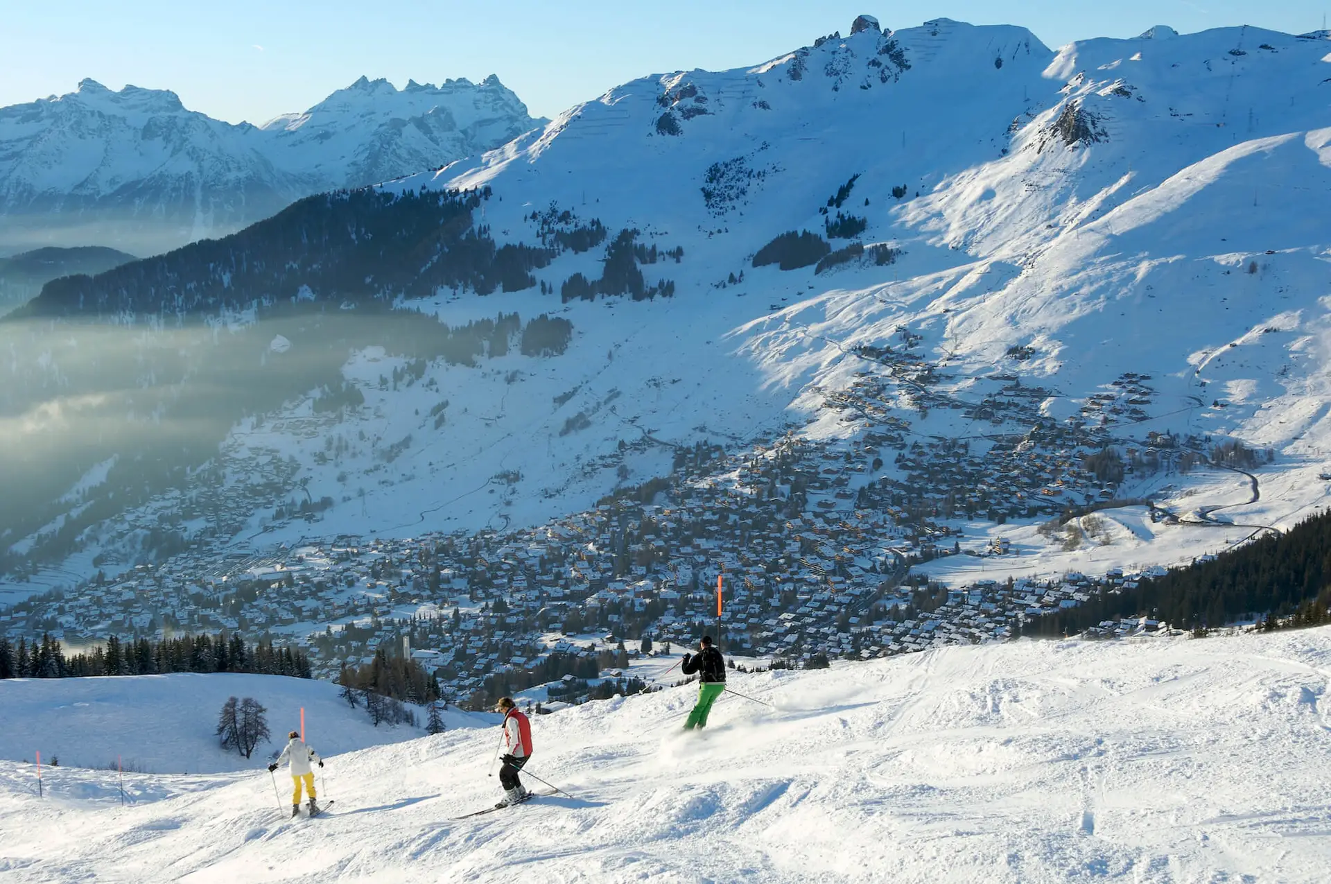 Skiers on the pistes above Verbier village